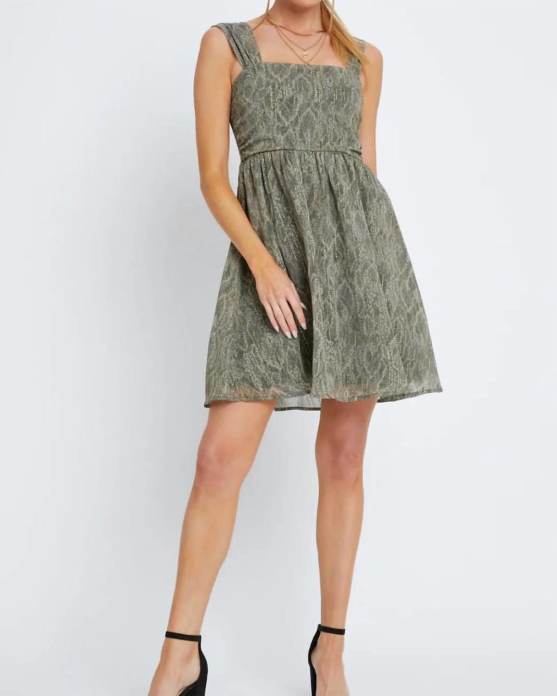 Front of a model wearing a size L Ariana Dress In Olive Slither in Olive Slither by Meet Me in Santorini. | dia_product_style_image_id:351489
